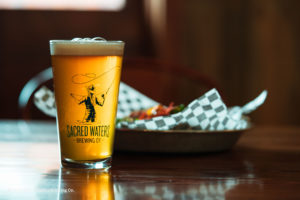 Enjoy a cool glass of beer at Sacred Waters Brewing Co.