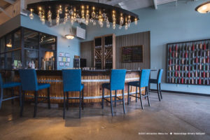 Blue Chairs at rounded edge bar at Waters Edge Winery