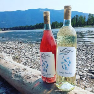 Waters Edge Winery wine bottles on lake edge