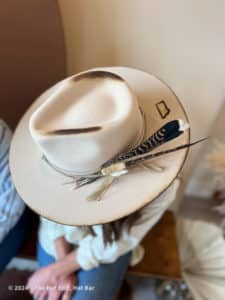 white western hat with feather